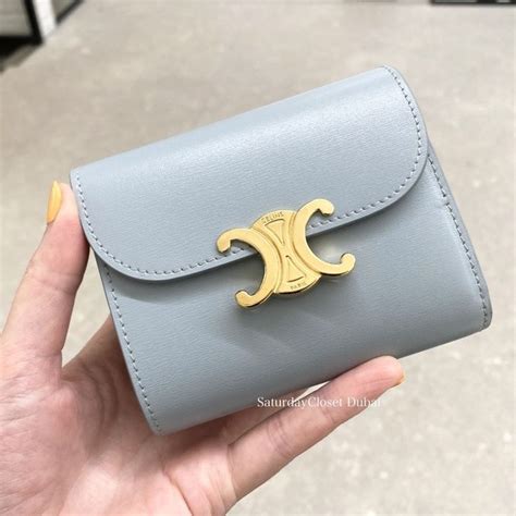 celine tri fold steel blue|Celine triomphe purses.